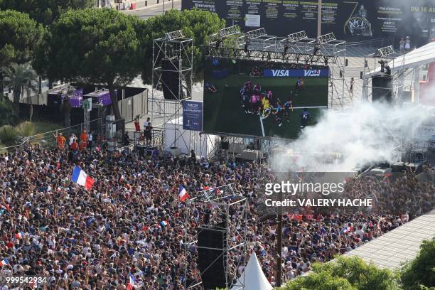 Supporters of the French national football team react as they watch the Russia 2018 World Cup final football match between France and Croatia, on...