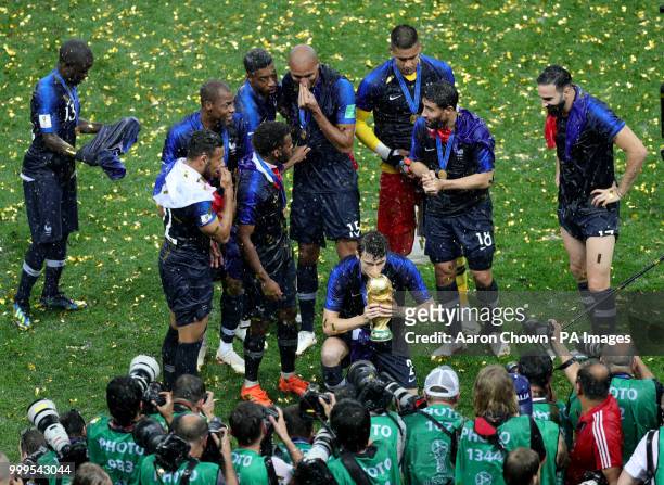 France's Benjamin Pavard celebrates with the trophy after winning the FIFA World Cup Final at the Luzhniki Stadium, Moscow.
