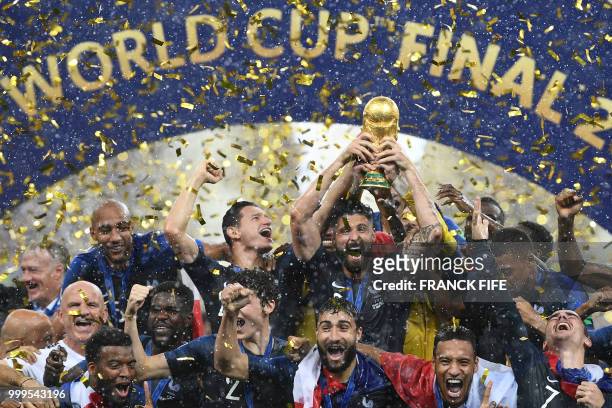 France's players hold their World Cup trophy as they celebrate their win during the trophy ceremony at the end of the Russia 2018 World Cup final...