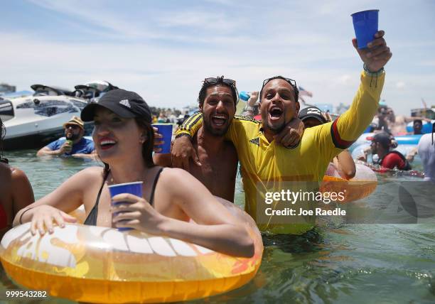 People react to France scoring their 2nd goal against Croatia in the World Cup final as it is being broadcast from the Ballyhoo Media boat setup in...