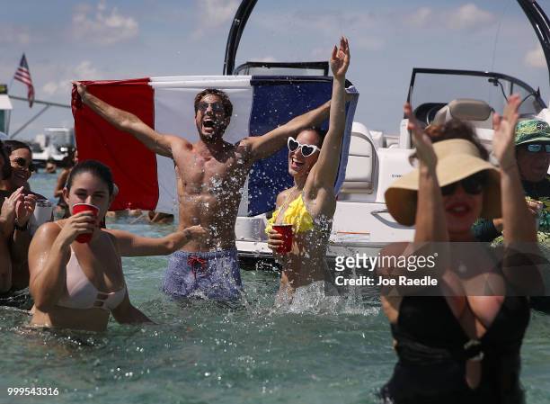 People react to France scoring their 2st goal against Croatia in the World Cup final as it is being broadcast from the Ballyhoo Media boat setup in...