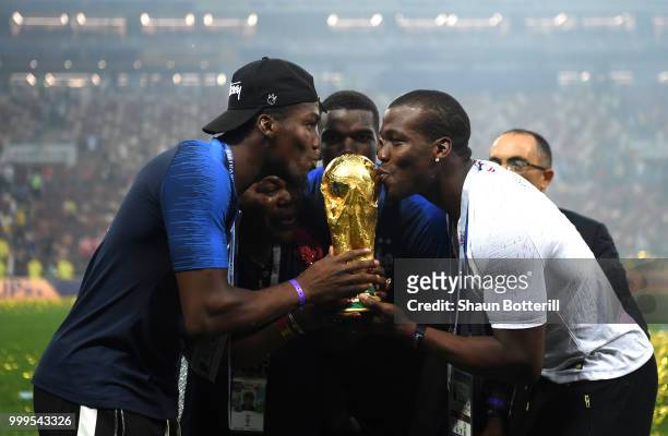 Paul Pogba of France celebrates victory with brothers Mathias and Florentin during the 2018 FIFA World Cup Final between France and Croatia at...