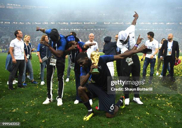 Paul Pogba of France celebrates victory with mother Yeo and brothers Mathias and Florentin during the 2018 FIFA World Cup Final between France and...