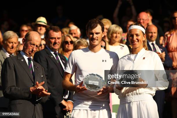 Jamie Murray of Great Britain and Victoria Azarenka of Belarus pose with their trophies after losing the Mixed Doubles final against Alexander Peya...