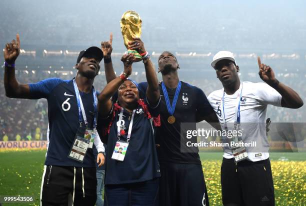 Paul Pogba of France celebrates victory with mother Yeo and brothers Mathias and Florentin during the 2018 FIFA World Cup Final between France and...