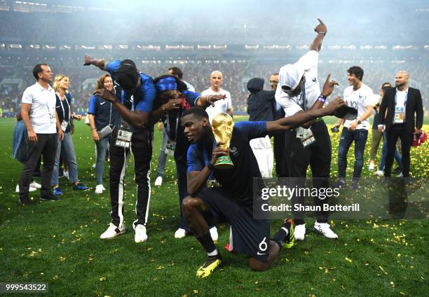 Paul Pogba of France celebrates victory with mother Yeo and brothers Mathias and Florentin during the 2018 FIFA World Cup Final between France and...