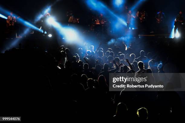 Revellers dance during Combo Ginebra of Chile performance in the 21st Rainforest World Music Festival 2018 at Sarawak Cultural Village on July 15,...