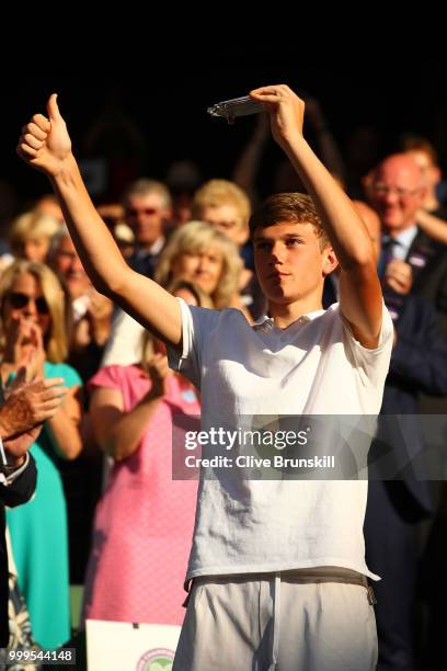 Jack Draper of Great runner-up in the Boys' Singles final, poses with his trophy at Centre Court on day thirteen of the Wimbledon Lawn Tennis...