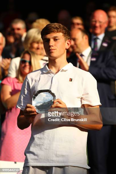 Jack Draper of Great runner-up in the Boys' Singles final, poses with his trophy at Centre Court on day thirteen of the Wimbledon Lawn Tennis...