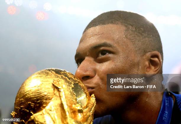 Kylian Mbappe of France kisses the World Cup trophy following the 2018 FIFA World Cup Final between France and Croatia at Luzhniki Stadium on July...