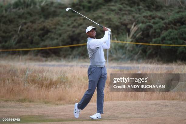 Golfer Tiger Woods plays a shot on the 2nd during the first practice session at The 147th Open Championship at Carnoustie, Scotland on July 15, 2018.