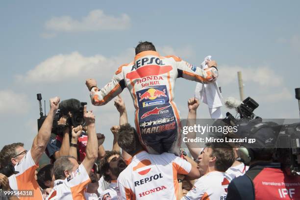 Marc Marquez of Spain and Repsol Honda Team celebrates the victory withe team under the podium at the end of the MotoGP race during the MotoGp of...