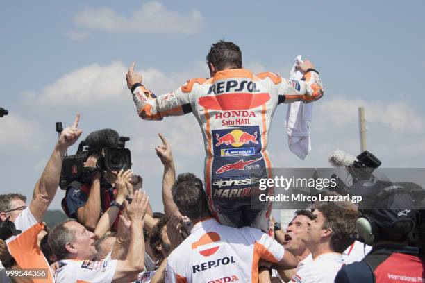 Marc Marquez of Spain and Repsol Honda Team celebrates the victory withe team under the podium at the end of the MotoGP race during the MotoGp of...