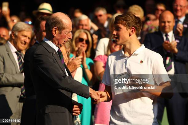 Jack Draper of Great runner-up in the Boys' Singles final, shakes hands with Prince Edward, Duke of Kent at Centre Court on day thirteen of the...