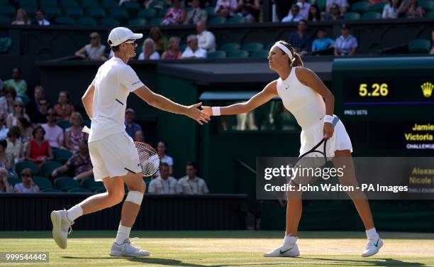 Jamie Murray and Victoria Azarenka during the doubles on day thirteen of the Wimbledon Championships at the All England Lawn Tennis and Croquet Club,...
