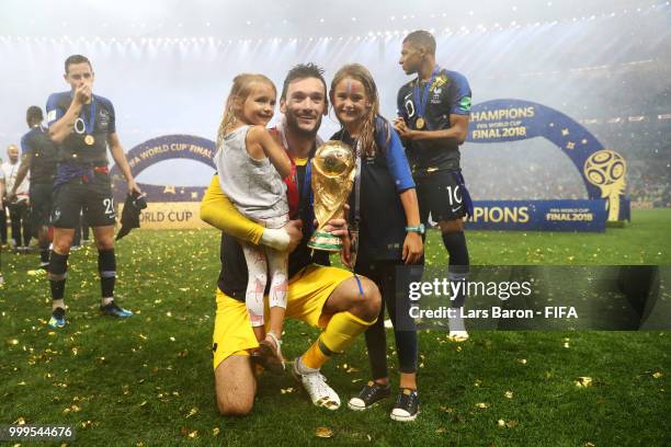 Hugo Lloris of France celebrates victory with daughters Anna Rose and Giuliana following the 2018 FIFA World Cup Final between France and Croatia at...
