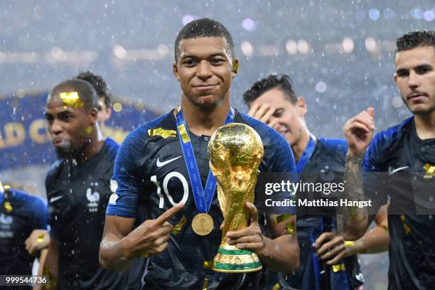 Kylian Mbappe of France celebrates with the World Cup trophy following the 2018 FIFA World Cup Final between France and Croatia at Luzhniki Stadium...