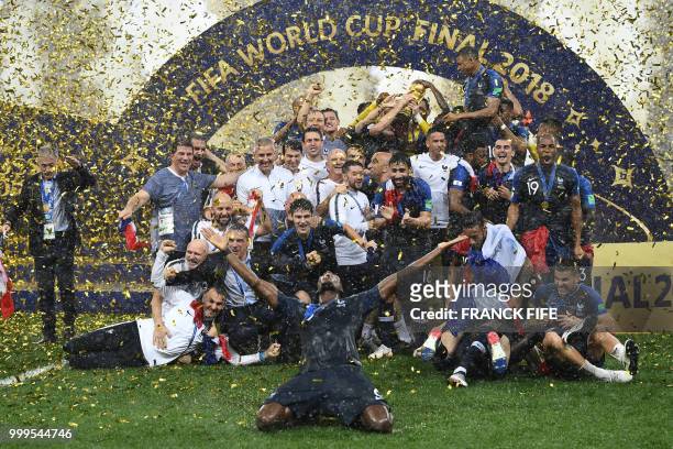 France's players hold their World Cup trophy as they celebrate their win during the trophy ceremony at the end of the Russia 2018 World Cup final...