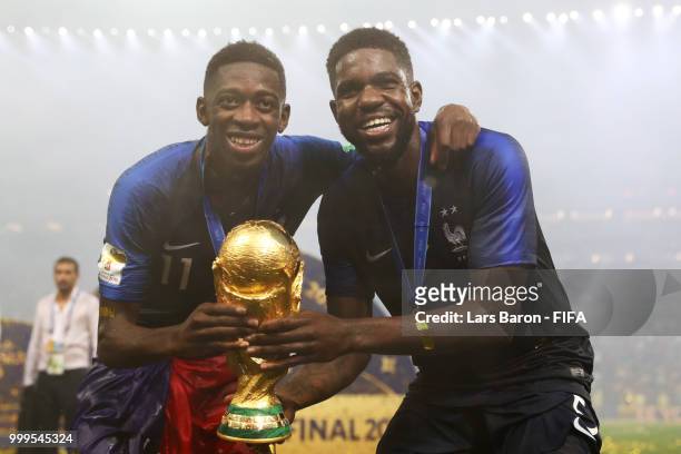 Samuel Umtiti and Ousmane Dembele of France celebrate victory following the 2018 FIFA World Cup Final between France and Croatia at Luzhniki Stadium...