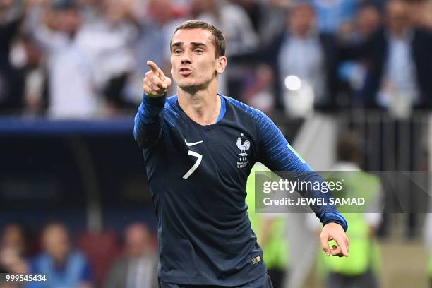 France's forward Antoine Griezmann celebrates his team's third goal during the Russia 2018 World Cup final football match between France and Croatia...