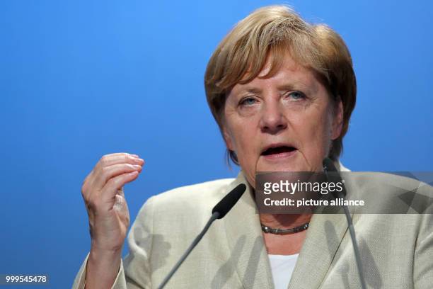 German Chancellor Angela Merkel speaking during a campaign event of the CSU in Erlangen, Germany, 30 August 2017. Photo: Daniel Karmann/dpa