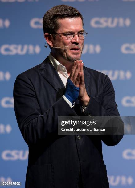 Former German Defence Minister Karl-Theodor zu Guttenberg giving thanks after a speech at a CSU electoral campaign event in the Stadthalle in...