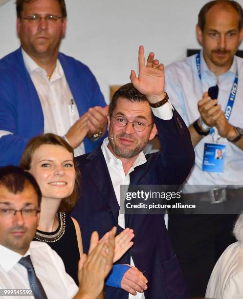 Former German Defence Minister Karl-Theodor zu Guttenberg waving to his supporters at a CSU electoral campaign event in the Stadthalle in Kulmbach,...