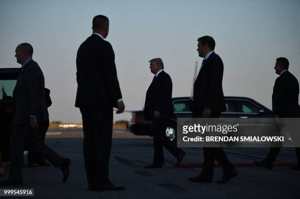 President Donald Trump walks towards the Presidential car upon arrival at Helsinki-Vantaa Airport in Helsinki, on July 15, 2018 on the eve of a...