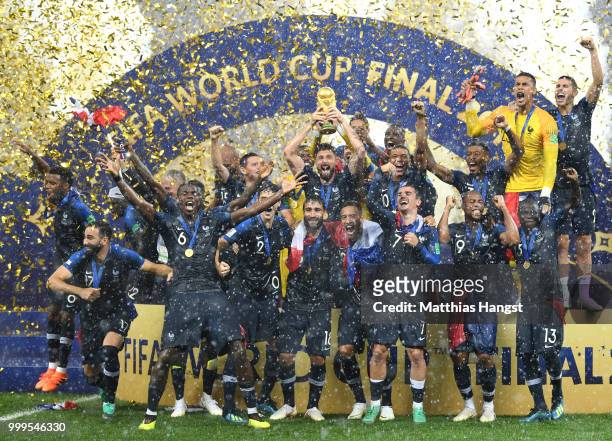 Hugo Lloris and Olivier Giroud of France lift the World Cup trophy to celebrate with teammates after the 2018 FIFA World Cup Final between France and...