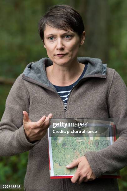 Forestry student and dog handler Svenja Schmidt speaks in the nature reserve 'Lauenberger Eichen' in Lauenberg, Germany, 31 August 2017. The forestry...