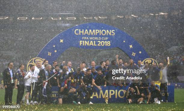 French players hold up the trophy as they celebrate FIFA World Cup championship after the 2018 FIFA World Cup Russia final match between France and...