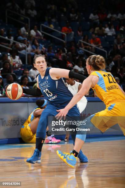 Lindsay Whalen of the Minnesota Lynx passes the ball around Courtney Vandersloot of the Chicago Sky on July 07, 2018 at the Wintrust Arena in...
