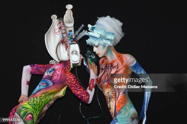 Models, painted by bodypainting artist Alex Hansen from Brasil and Benoit Botella from Guadaloupe, pose for a picture at the 21st World Bodypainting...