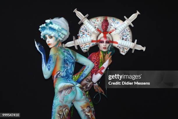 Models, painted by bodypainting artist Alex Hansen from Brasil and Benoit Botella from Guadaloupe, pose for a picture at the 21st World Bodypainting...