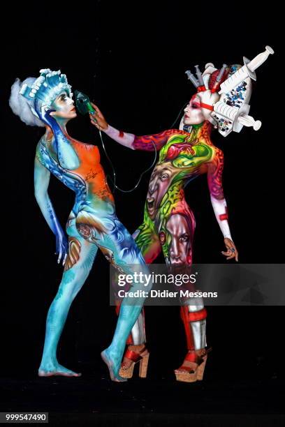 Models, painted by bodypainting artist Alex Hansen from Brasil and Benoit Botella from Guadaloupe, pose for a picture at the 21st World Bodypainting...
