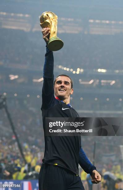 Antoine Griezmann of France lifts the World Cup trophy in celebration following the 2018 FIFA World Cup Final between France and Croatia at Luzhniki...