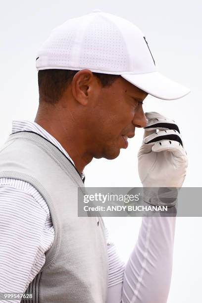 Golfer Tiger Woods gestures as he walks on the 4th fairway during the first practice session at The 147th Open Championship at Carnoustie, Scotland...