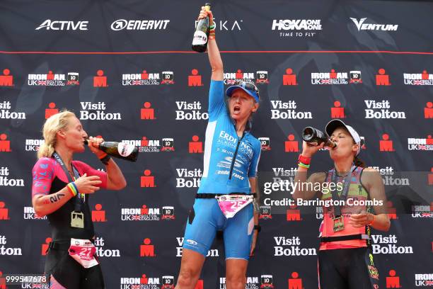 Lucy Gossage of Great Britain celebrates winning the Iron Man in Bolton with runners up Camilla Lindholm of Sweden Angela Naeth of Canada during the...