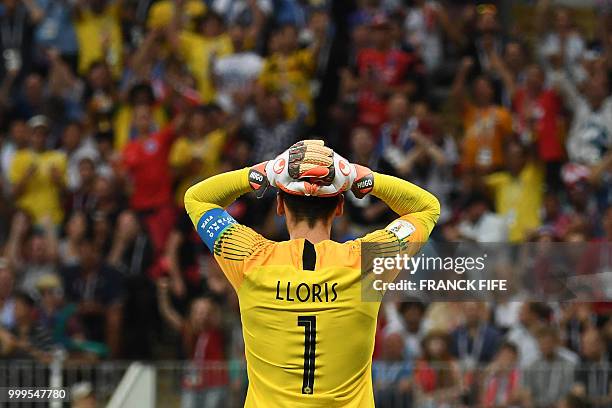 France's goalkeeper Hugo Lloris reacts to Croatia's forward Mario Mandzukic's score during the Russia 2018 World Cup final football match between...