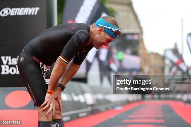 Competitor gets emotional after completing the run during the Iron Man Triathlon in Bolton on July 15, 2018 in Bolton, England.