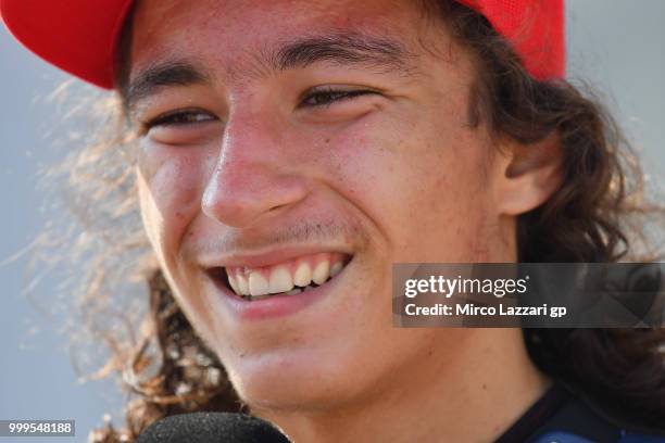 Can Oncu of Turkie celebrates the victory under the podium at the end of the RookiesCup race during the MotoGp of Germany - Race at Sachsenring...