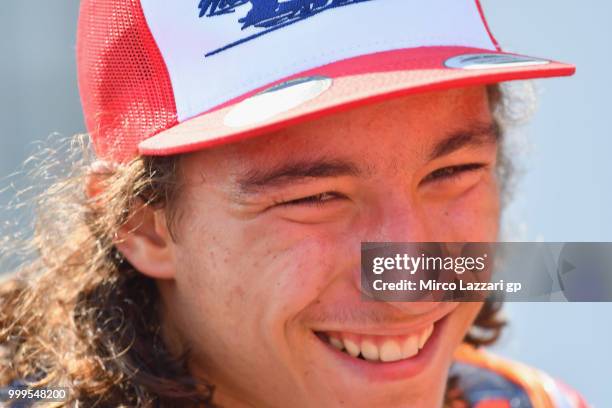 Can Oncu of Turkie celebrates the victory under the podium at the end of the RookiesCup race during the MotoGp of Germany - Race at Sachsenring...