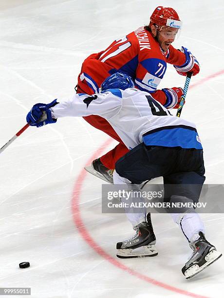 Russia's Ilya Kovalchuk of NHL's New Jersey Devils vies with Finland's Sami Vatanen during a qualification round match of the IIHF International Ice...