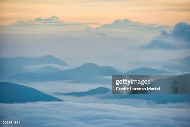 sunrise above the clouds, mount cucco, umbria, apennines, italy - lorenzo stock pictures, royalty-free photos & images