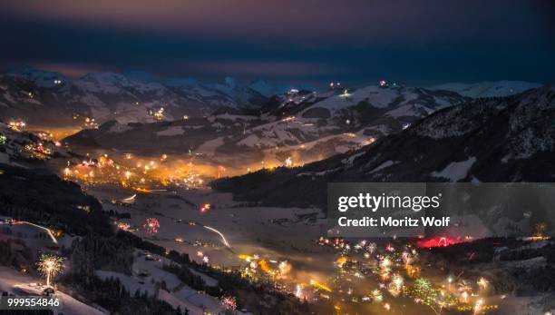 fireworks over the alps, hochbrixen and kirchberg, brixen im thale, tyrol, austria - kirchberg austria stock pictures, royalty-free photos & images