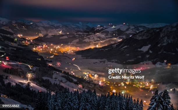 fireworks over the alps, hochbrixen and kirchberg, brixen im thale, tyrol, austria - kirchberg austria stock pictures, royalty-free photos & images