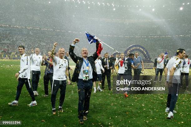 France's coach Didier Deschamps celebrates after the Russia 2018 World Cup final football match between France and Croatia at the Luzhniki Stadium in...