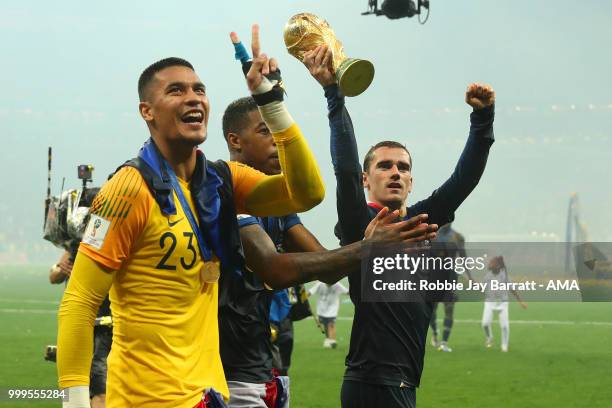 Antoine Griezmann of Franceand Alphonse Areola of France celebrate with the trophy at the end of of the 2018 FIFA World Cup Russia Final between...