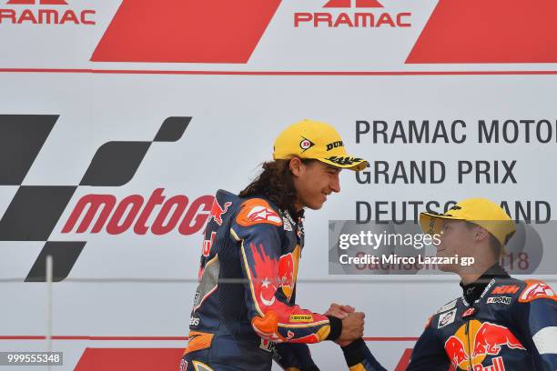 Can Oncu of Turkie celebrates the victory on the podium with Filip Salac of Czech Rep. At the end of the RookiesCup race during the MotoGp of Germany...