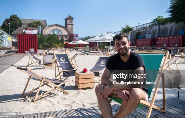 Alexander Skornia, director of "1 Stralau", sits on a lounger in the beach area of the club, bordering the River Spree, in Berlin, Germany, 30 August...